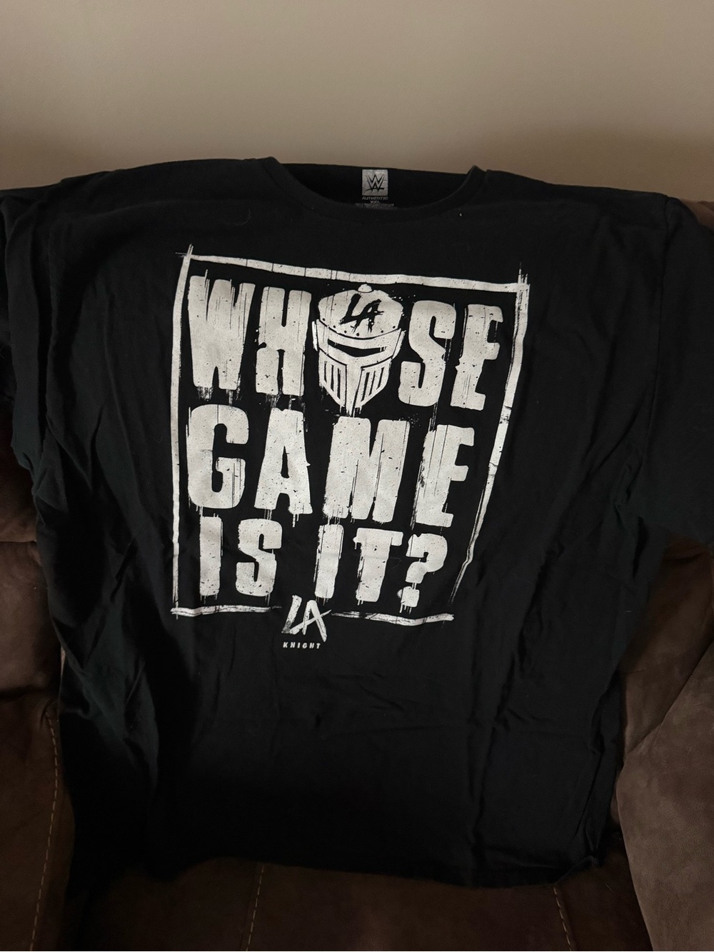 WWE LA Knight Black Tee with White 'Whose Game Is It?' Graphic